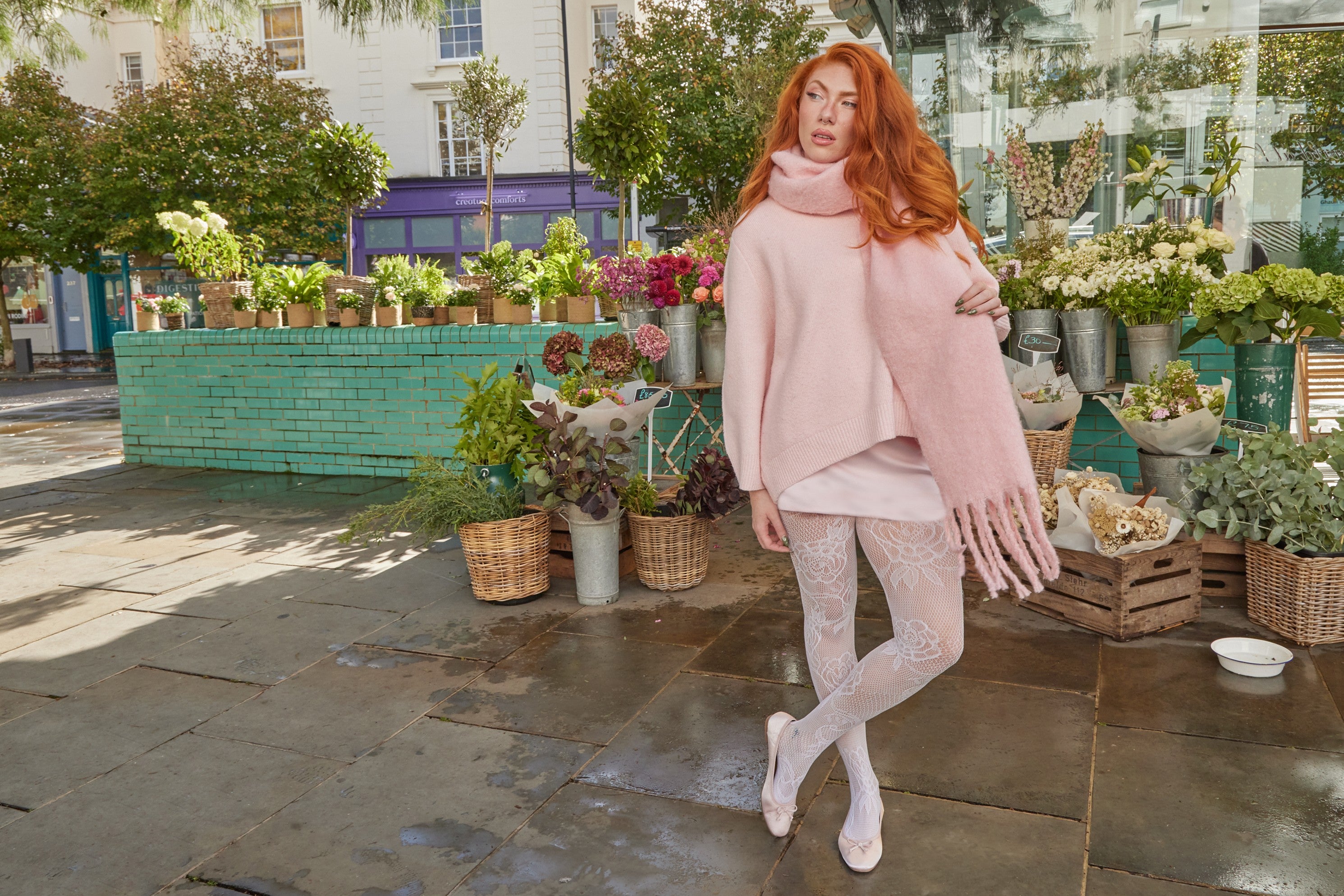 Girl wearing baby pink oversized fluffy scarf